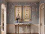 Hand-carved gilded wood frame with oval detailing, styled in a salon setting.