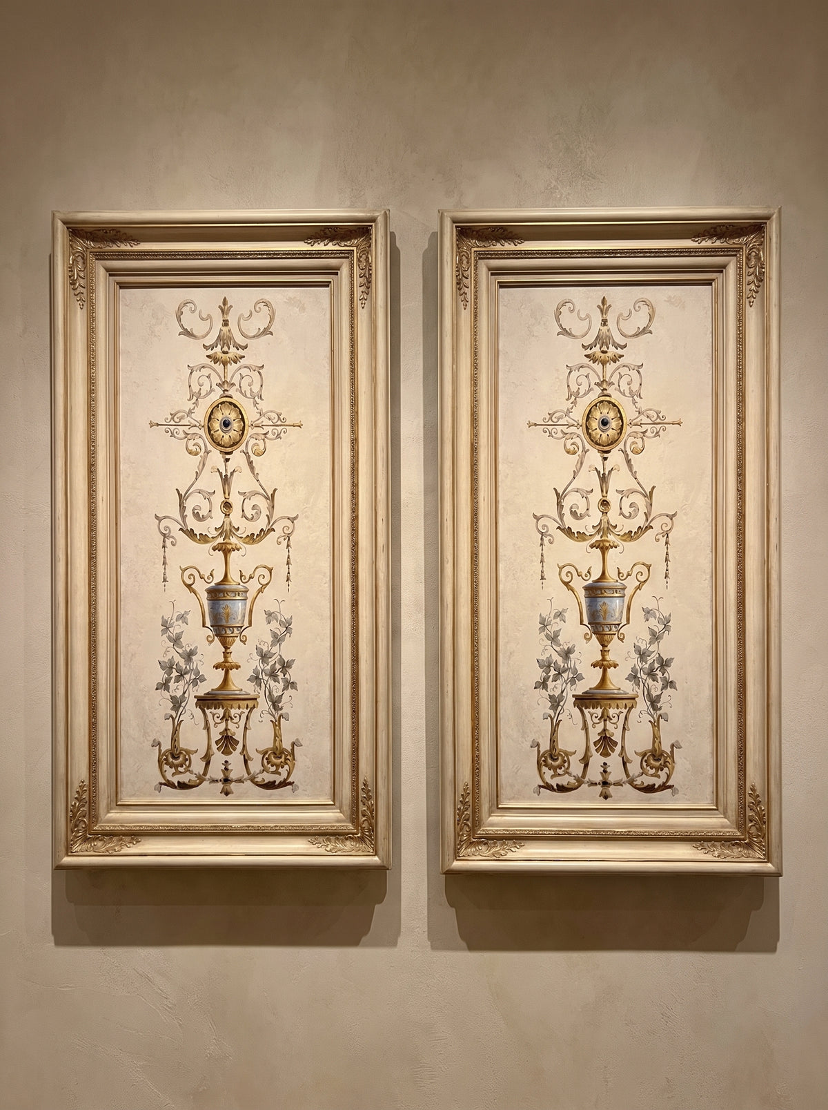 Hand-carved gilded wood frame with oval detailing, styled in a salon setting.