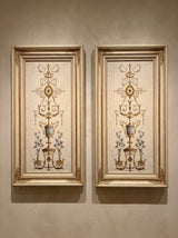 Hand-carved gilded wood frame with oval detailing, styled in a salon setting.