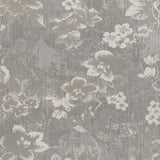Vinyl-print wallcovering in a fine botanical sprig motif on warm parchment ground, shown applied to a bedroom wall.