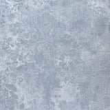 Vinyl-print wallcovering in a blue-grey tonal damask scroll motif, shown applied to a wall panel.