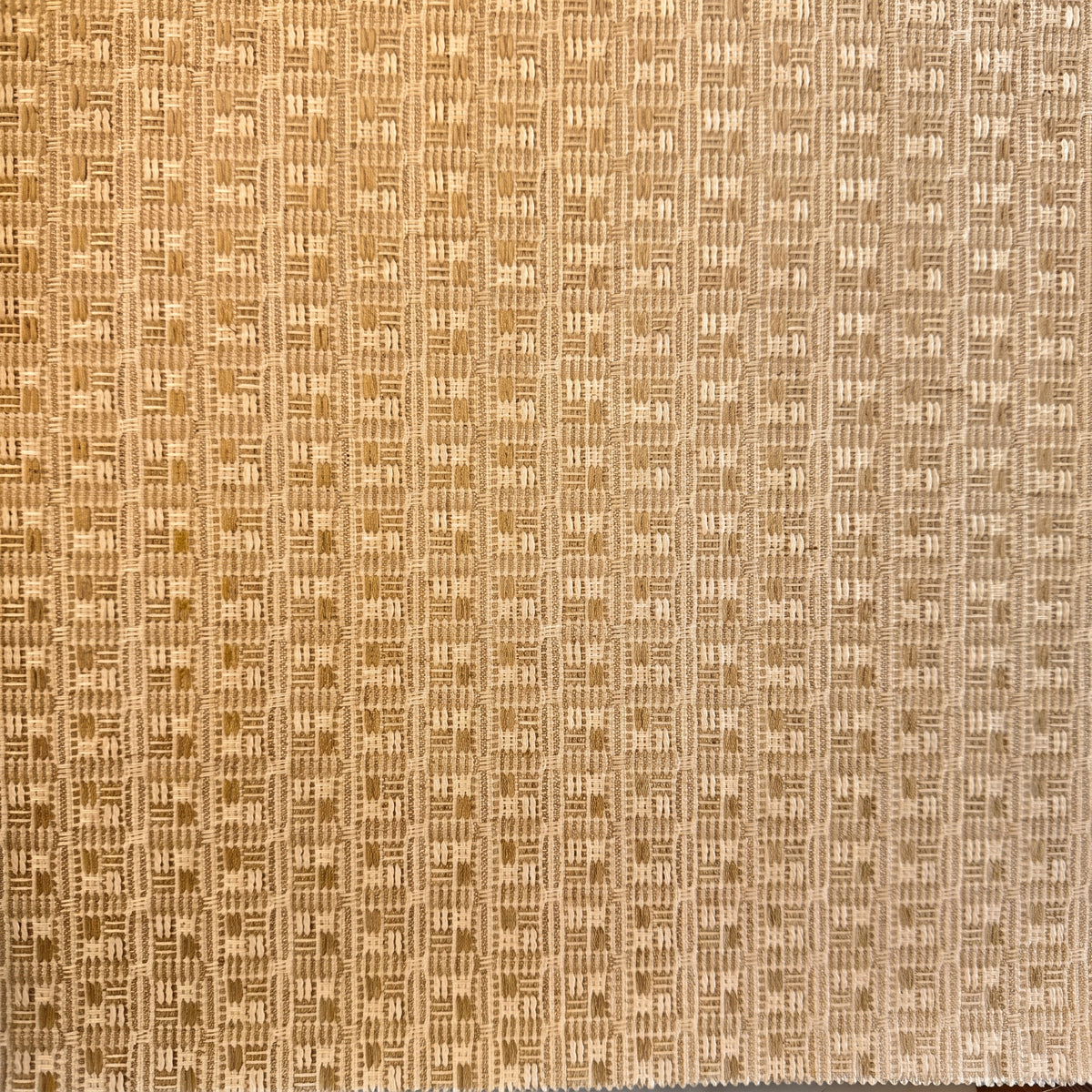 Vinyl-print wallcovering in a tan-and-gold vertical basket-weave motif, shown as a product swatch.