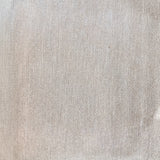 Plain tonal textured vinyl-backed wallcovering in soft irregular-grain finish, ivory-grey ground, shown applied to a wall.