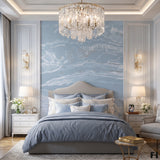 Vinyl-print wallcovering in a powder-blue abstract marbled wave motif, shown applied to a bedroom feature wall.