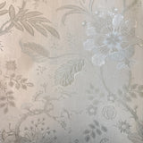 Vinyl-print wallcovering in a tone-on-tone ivory jacquard floral motif, shown as a product swatch.