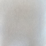 Plain tonal textured vinyl-backed wallcovering in fine seamless-grain finish, ivory ground, shown applied to a wall.