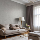 Plain tonal textured vinyl-backed wallcovering in fine seamless-grain finish, sandy-beige ground, shown applied to a wall.